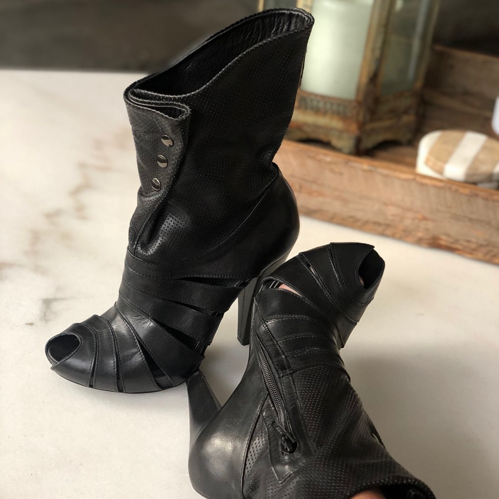 Black leather peep toe heels.